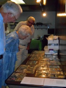 People looking at my display of postcards