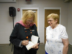 Author Angela Davis-Gardner, signing one of her novels for Marie Morrison
