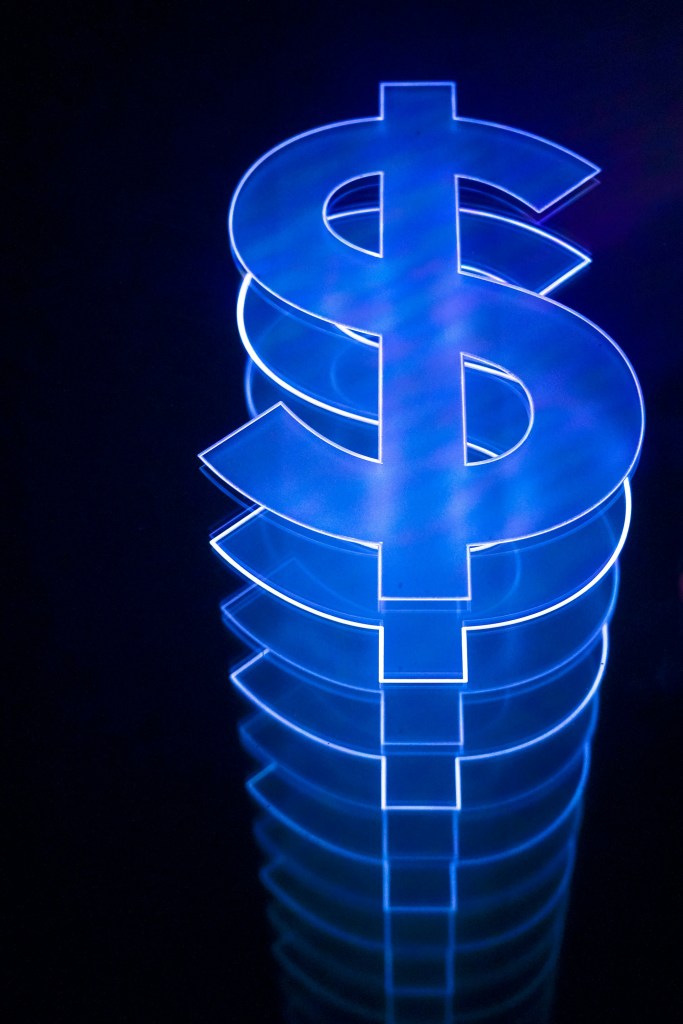A computer-generated photo of a stack of blue dollar signs